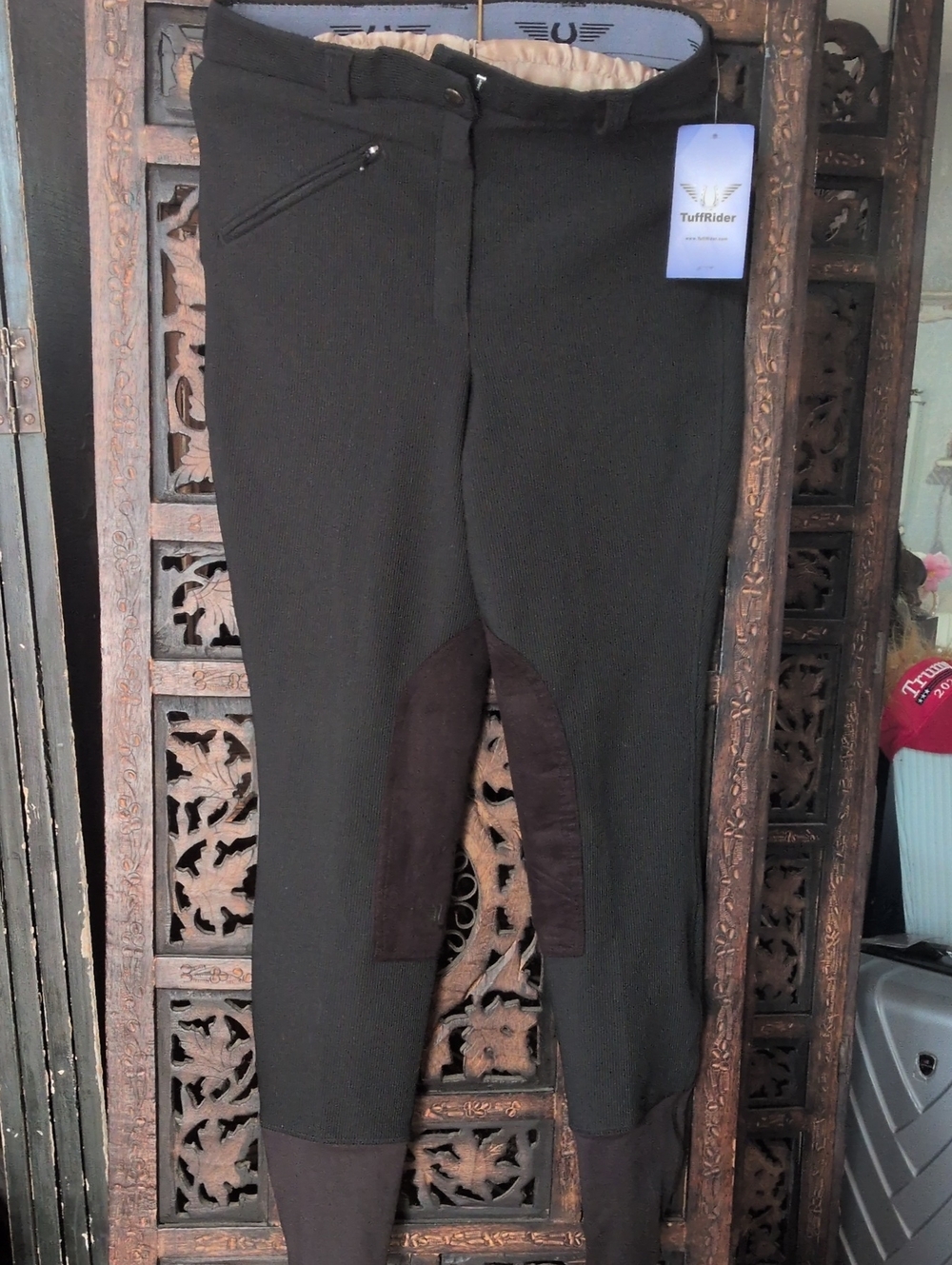 TuffRider Equestrian knee patch breeches in black, featuring a zip-front closure